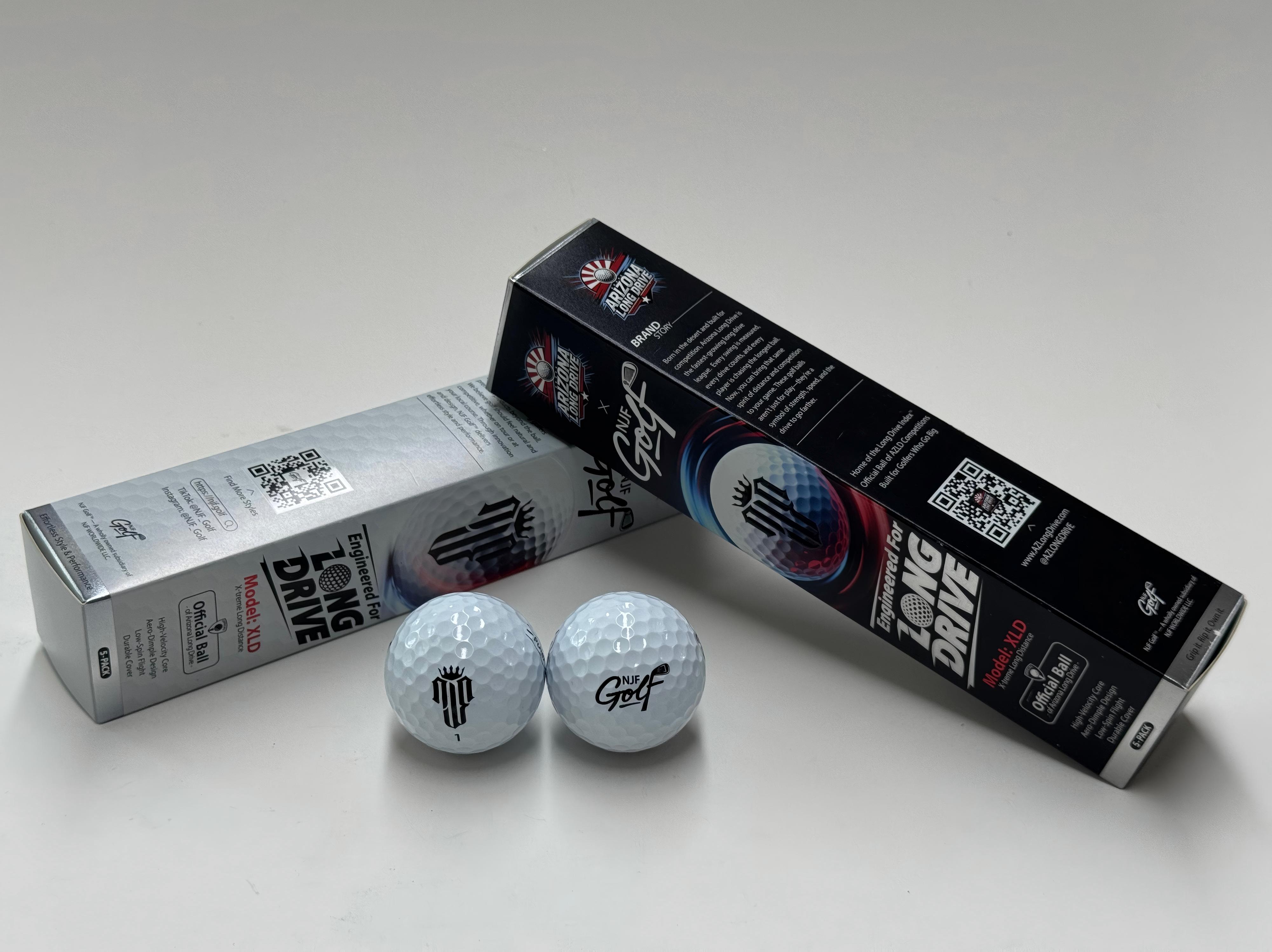 NJF XLD factory-finished product: completed 2-piece Surlyn distance golf balls with Arizona Long Drive co-branded retail packaging, photographed at MetaSeal factory on 2026-06-22
